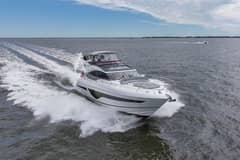 2020 Princess S66 - White motor yacht underway, viewed from forward starboard quarter