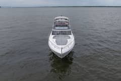 2020 Princess S66 - Bow-on aerial view of a white motor yacht on open water
