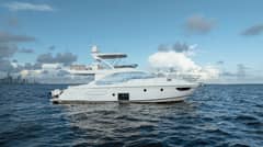 2020 Azimut 50 Flybridge - Starboard profile view of a white flybridge motor yacht on open water