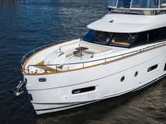 2018 66' 1" Azimut Magellano 66 - Bow of a white motor yacht with foredeck seating and table