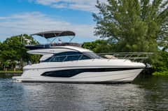 2025 47' 1" Princess F45 - Starboard profile view of a white flybridge motor yacht underway on water