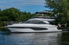 2025 47' 1" Princess F45 - Starboard profile of a white flybridge motor yacht underway on the water