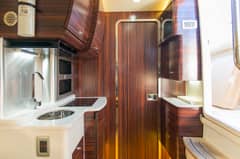 2017 42' 1" Scout 420 LXF - Below deck galley with sink, countertop, cabinetry and a door