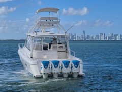 2018 47' 6" Intrepid 475 Sport Yacht - Stern view of express yacht on the water with four Yamaha V8 350 outboards