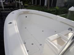 2017 28' Bluewater Sportfishing 2550 CC - Bow area with flush deck hatches, rod holders and forward seating