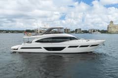 2022 Princess Y78 - Starboard profile of a white flybridge motor yacht underway on open water