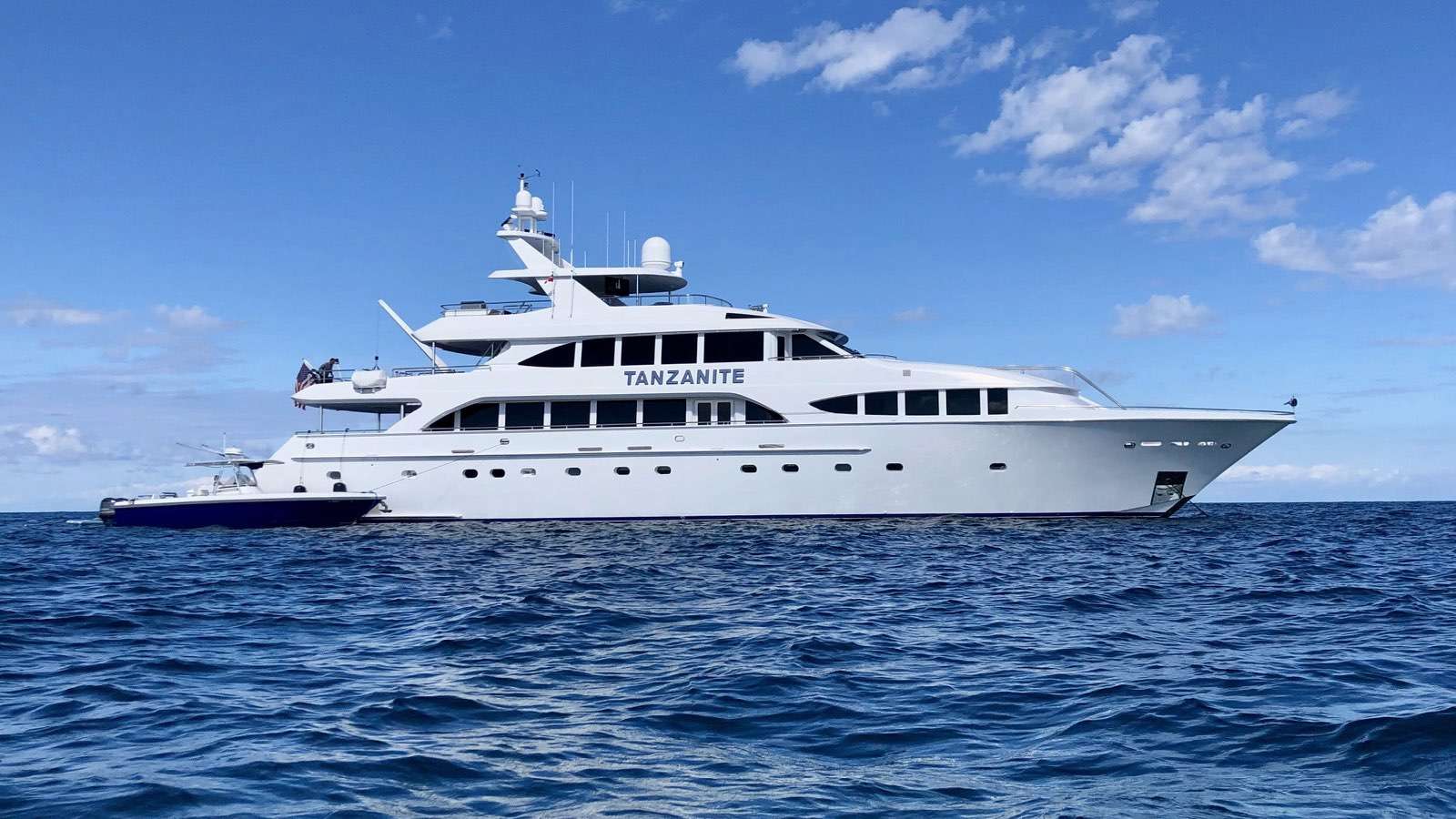 TANZANITE brings big-yacht vibes with incredible space for her size, making her a standout for unforgettable charters. Previously ex: FIGHTING IRISH she sleeps 10 guests in total comfort, with a full-beam master suite on the main deck and four king cabins below—two of which can easily convert to twins for added flexibility. Every cabin comes with its own Jacuzzi bath, giving each guest their own little slice of luxury. A dedicated crew of nine keeps everything running smoothly. The beach club is the perfect hideaway for morning dips or lazy afternoons by the water. Up top, you’ll find a large hot tub and four bars, setting the scene for everything from sunset cocktails to full-on celebrations. And thanks to a three-metre sundeck extension during her refit, TANZANITE now boasts an impressively spacious deck—made for lounging, entertaining, and soaking up those endless ocean views.