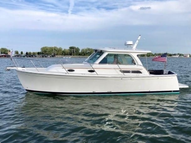 2019 30' 5" Back Cove 30 Downeast - Profile view of a white hardtop express cruiser on the water