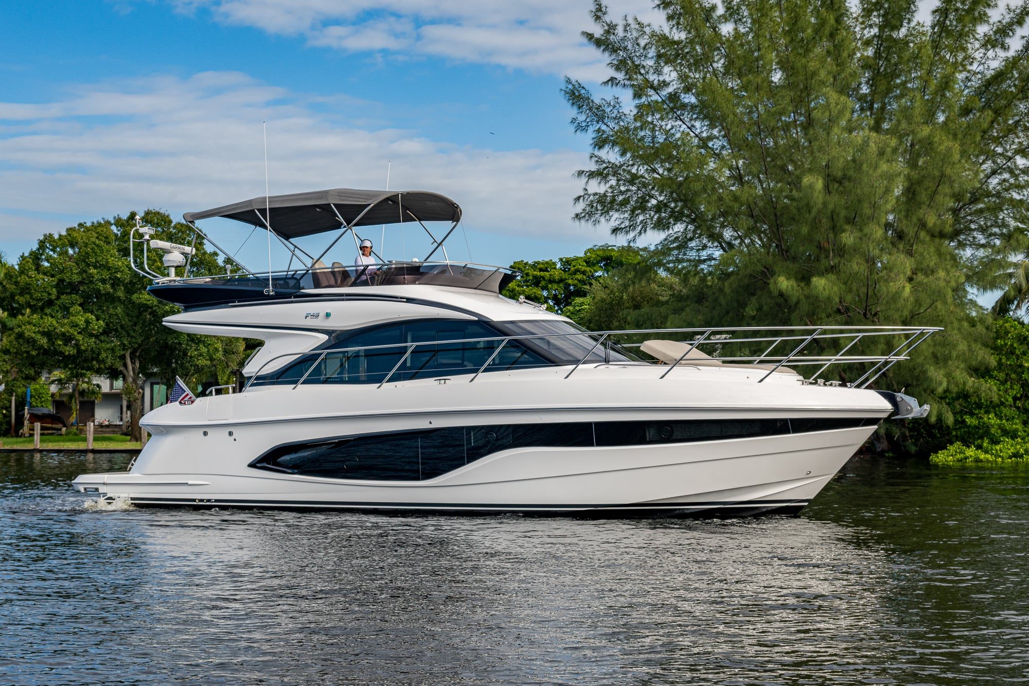 2025 47' 1" Princess F45 - Starboard profile view of a white flybridge motor yacht underway on water