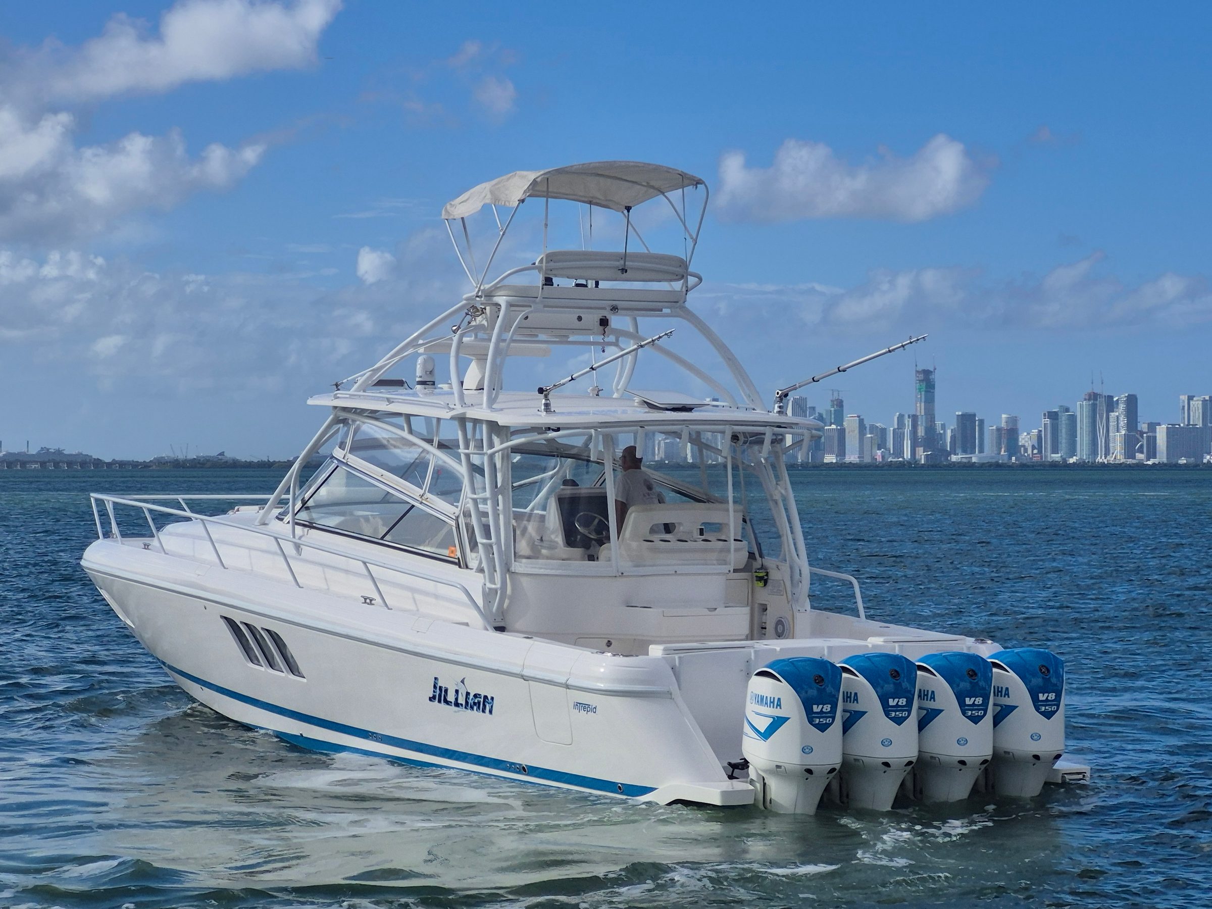 2018 47' 6" Intrepid 475 Sport Yacht - Port quarter view of white sport yacht with four Yamaha V8 350 outboards