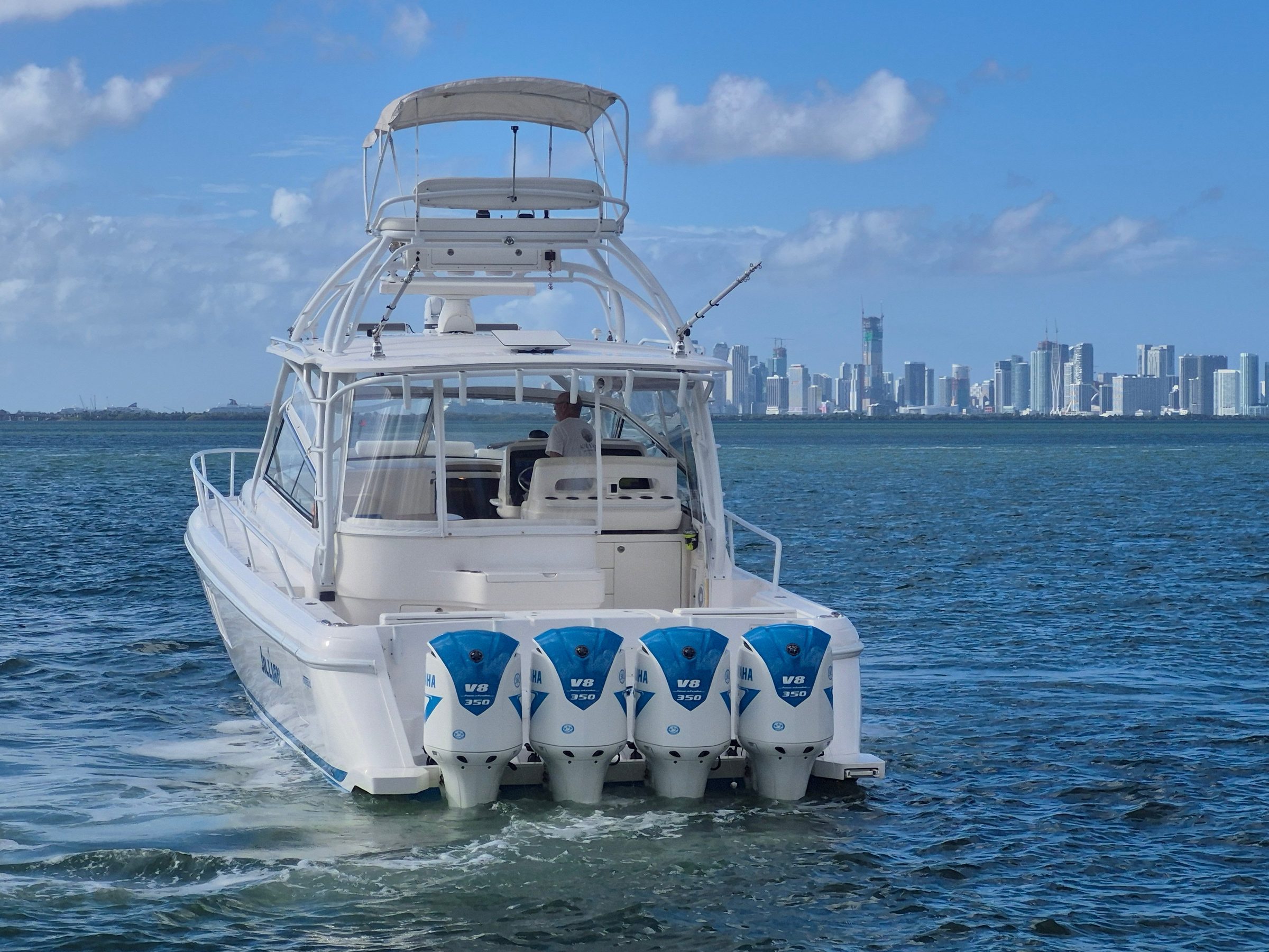 2018 47' 6" Intrepid 475 Sport Yacht - Stern view of express yacht on the water with four Yamaha V8 350 outboards