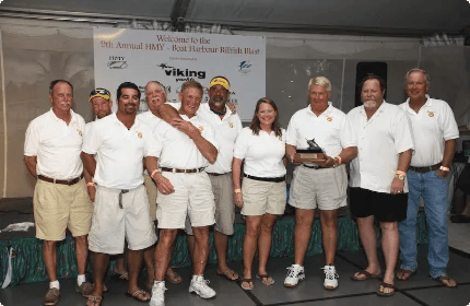 Team Bodacious accepting a tournament trophy at the HMY Rock Harbour Billfish Blast in 2008.