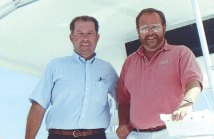 Steve Moynihan with longtime client Doc on the cockpit of a sportfish yacht in 1998.