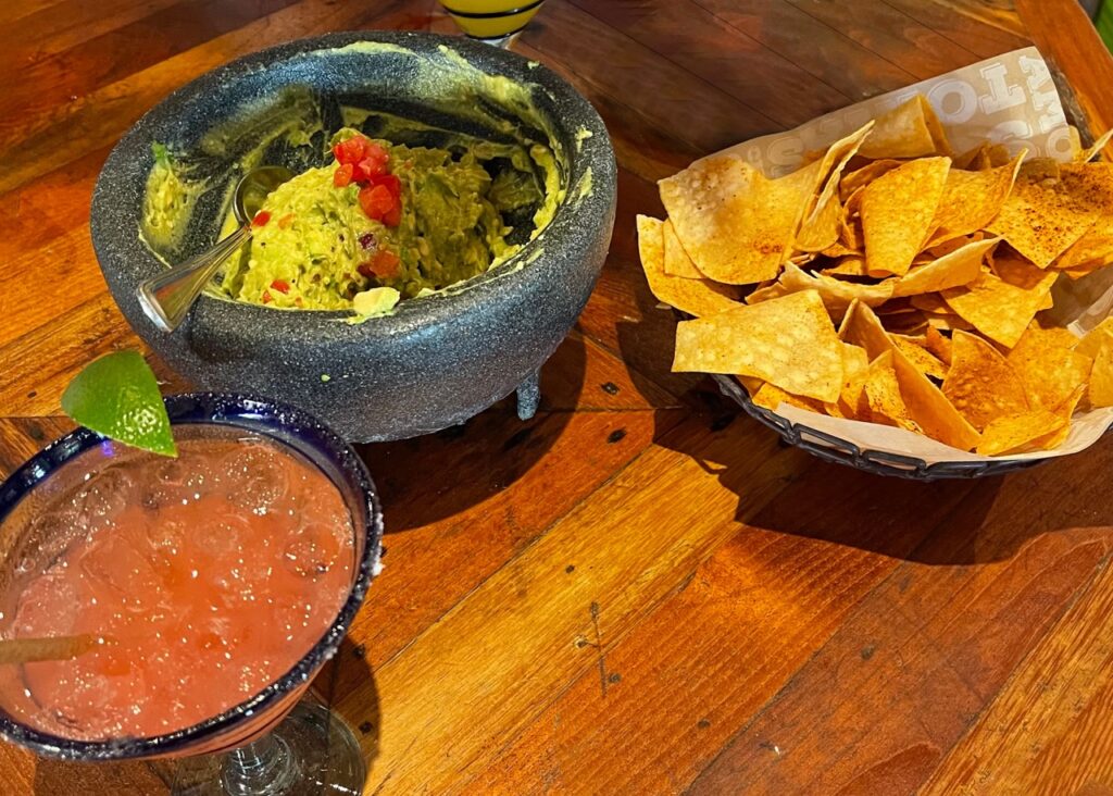 Tacos, margarita, tortilla chips, guac