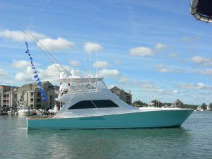 2005 Viking 61’ Convertible “Victory Lap” with a rigger full of release flags. 