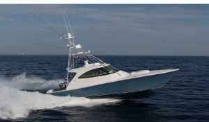 2022 Viking 54’ Sport Tower running offshore in the water. 