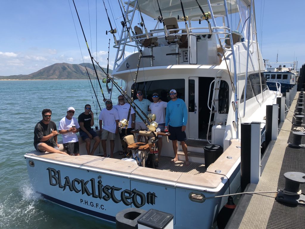 Blacklisted sportfish in lizard island with a crew of men. 