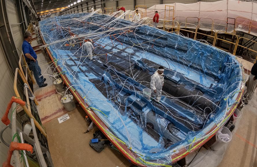 The keel is filled the resin and resin continues to be drawn outboard and up the hull sides