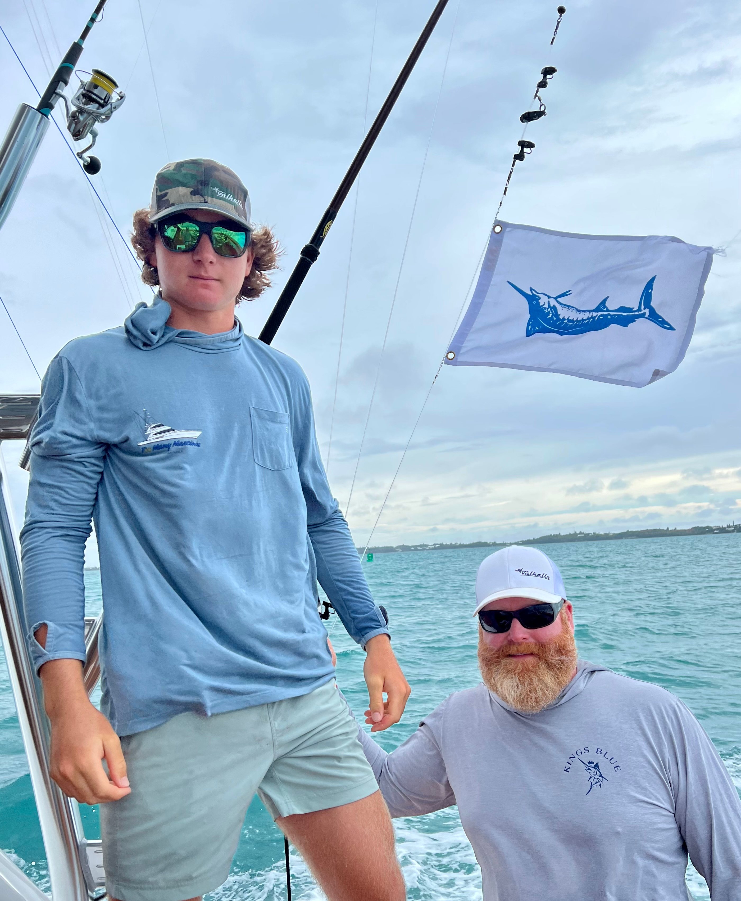 Will and Tim Gredick on board the Viking Demo 80 Sportfish with a blue marlin release flag. 