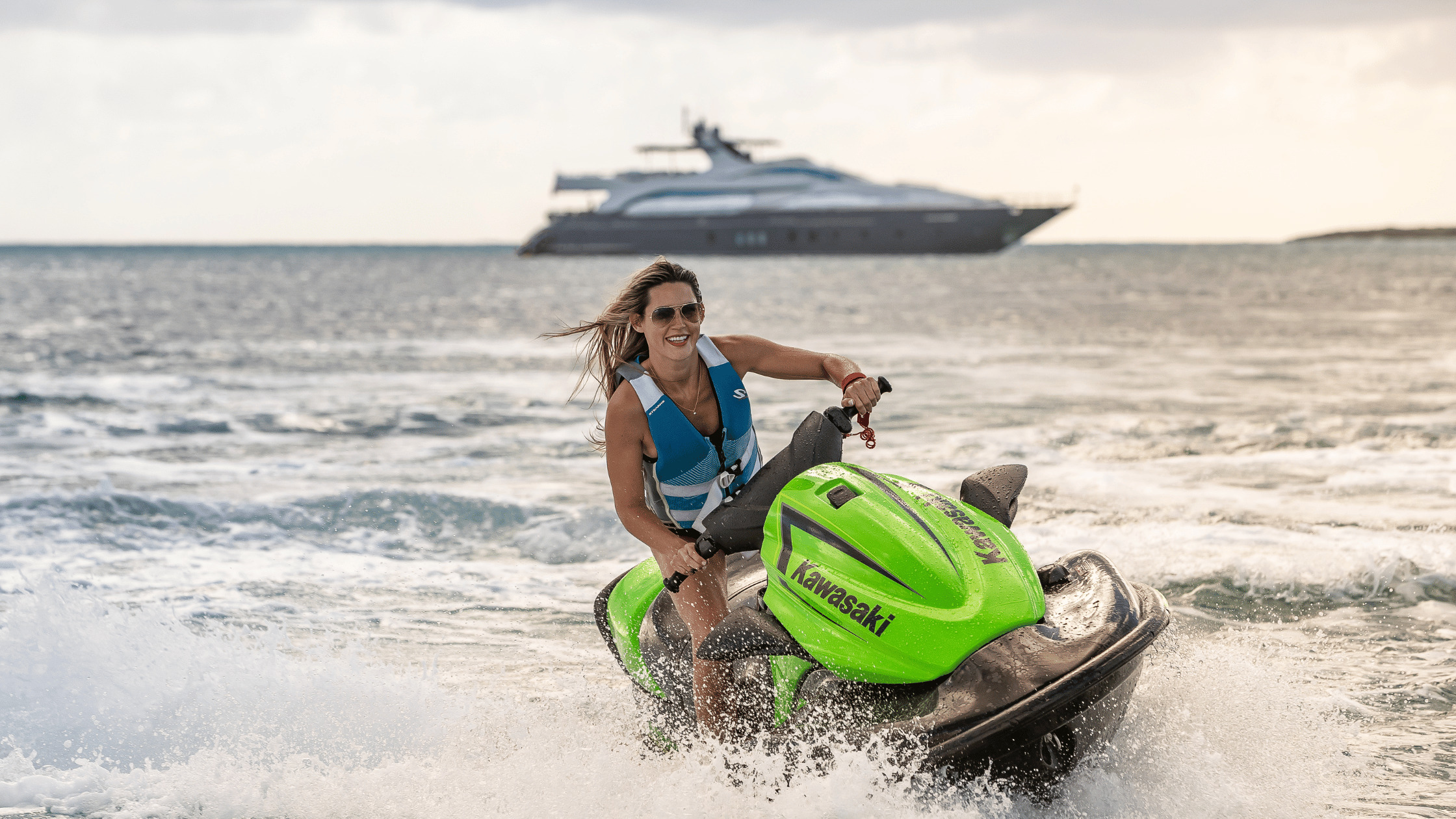 Jetski with yacht in the background on the water