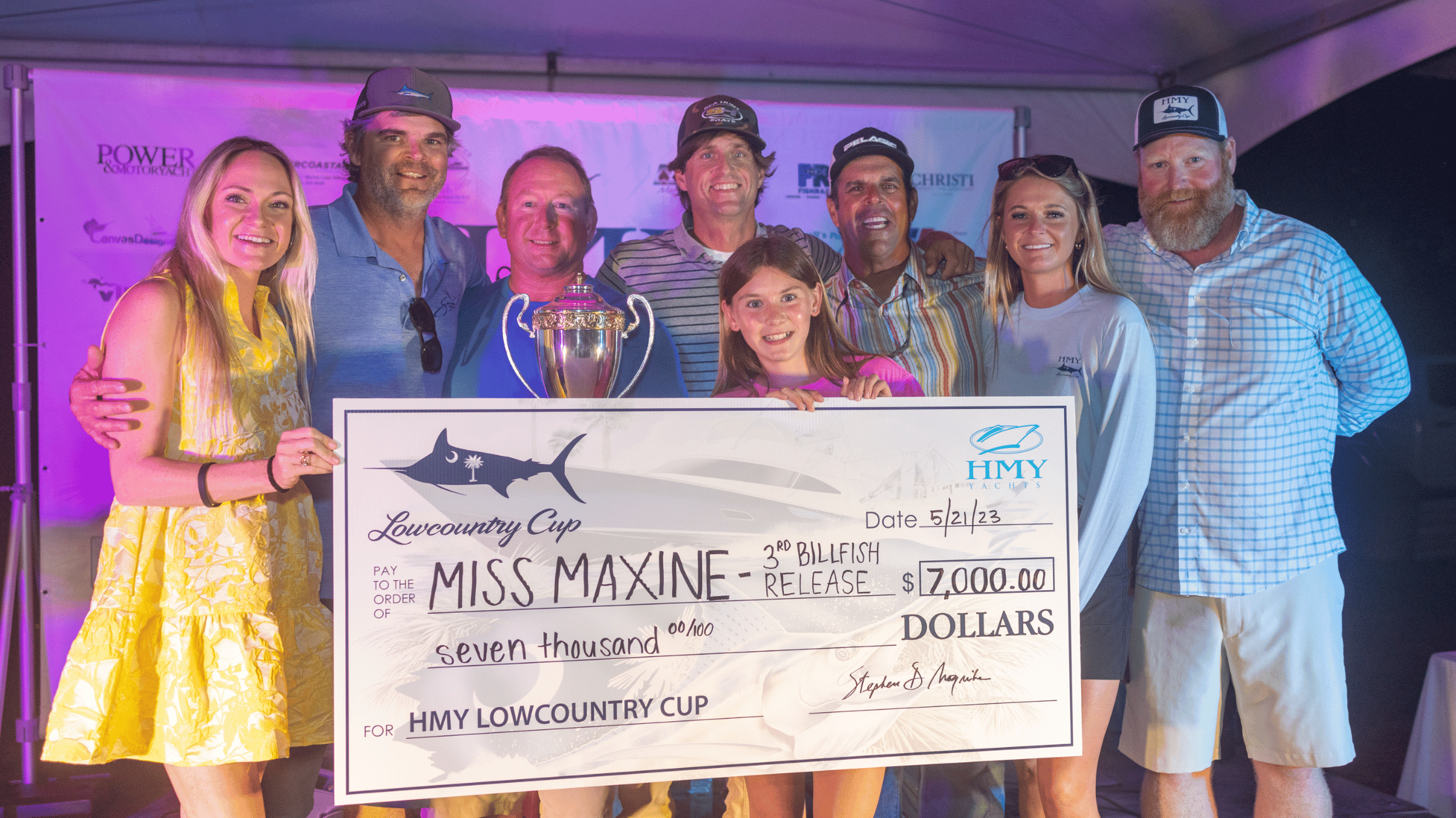 Team Miss Maxine holding a check for seven thousand dollars at the Lowcountry Cup. 