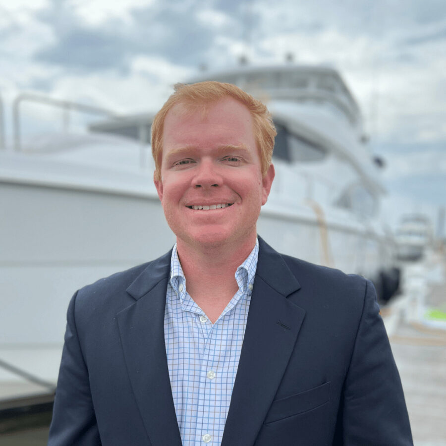HMY Yacht Professional Harrison Hughes Standing on the dock