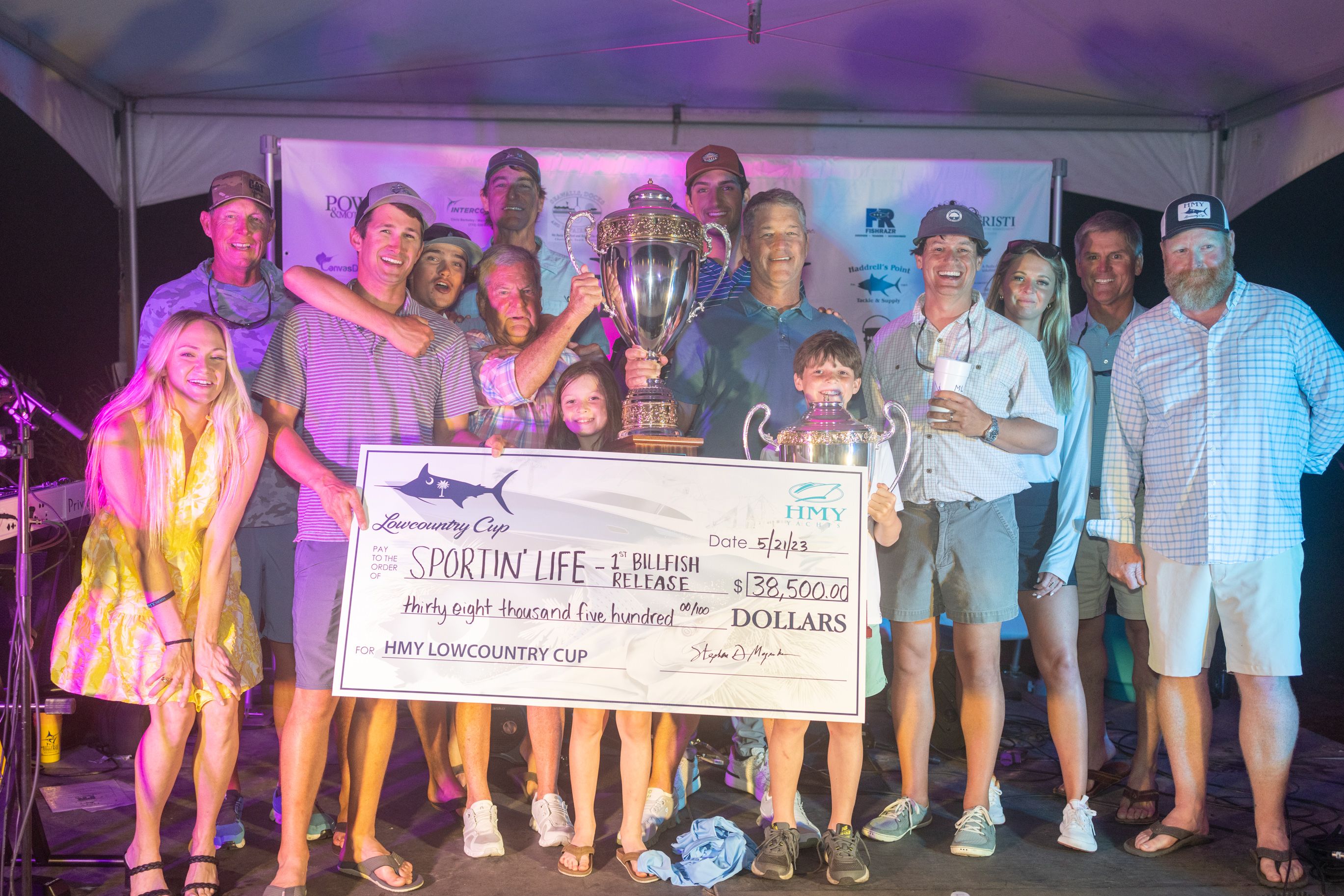 Team Sportin' Life holding a check at the 2023 HMY Lowcountry Cup fishing tournament. 